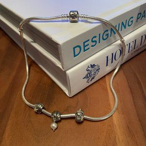 Pandora necklace with 3 charms. Excellent condition. Never worn.